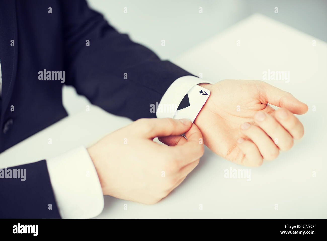 mans hand hiding ace in the sleeve Stock Photo Alamy