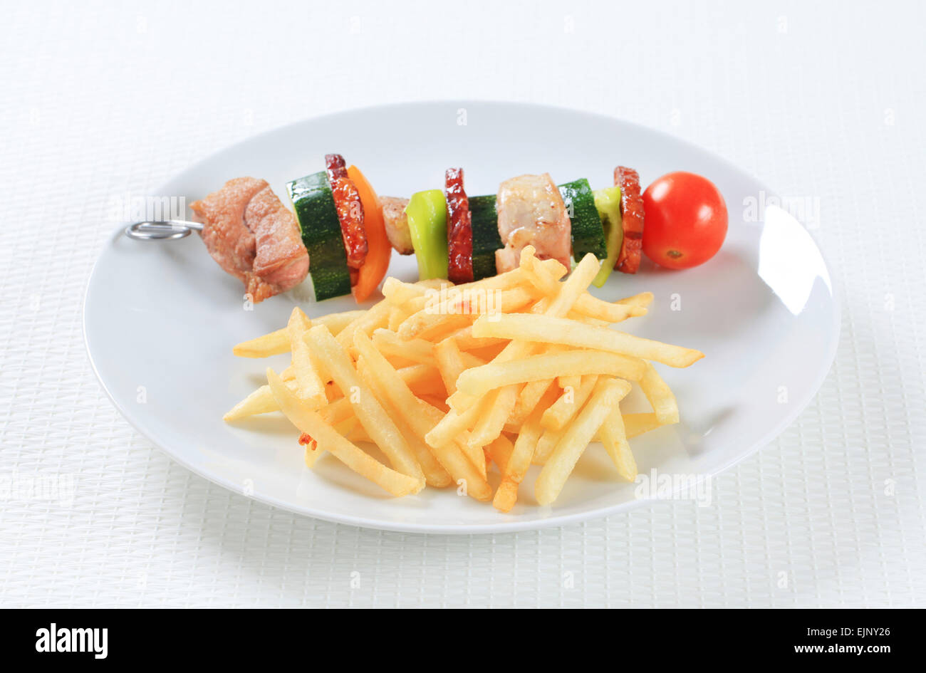 Shish kebab with French fries Stock Photo Alamy