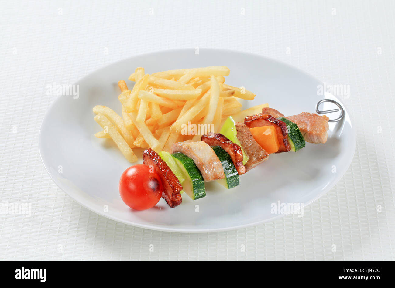 Shish kebab with French fries Stock Photo Alamy