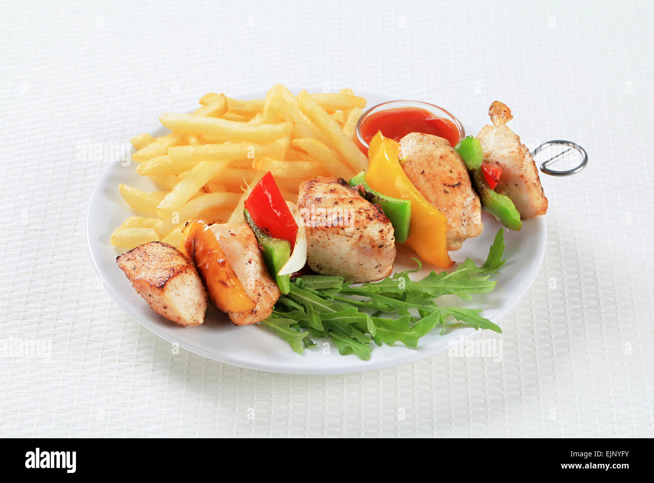 Chicken Shish kebab with French fries and ketchup Stock Photo Alamy
