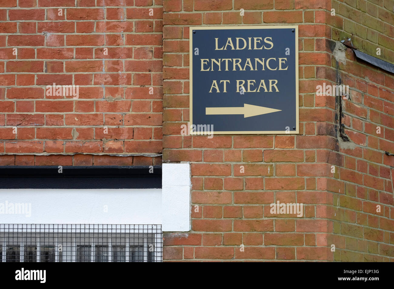 a sign showing the way to ladies separate entrance into the jami mosque southsea portsmouth a sign showing the way to ladies separate entrance into the jami mosque southsea portsmouth