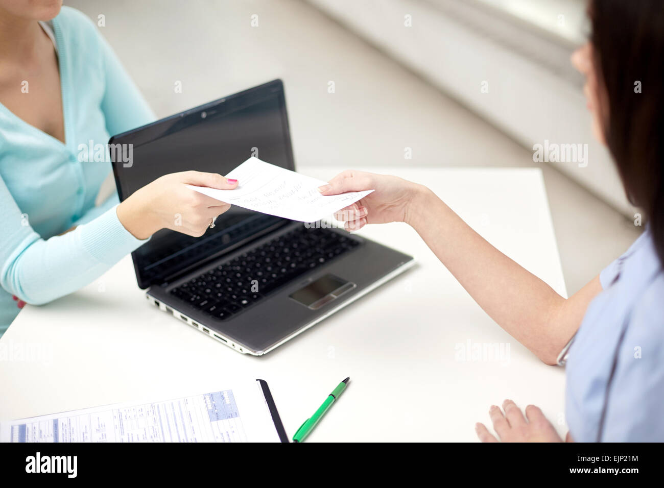Doctor giving medical certificate hi-res stock photography and images ...