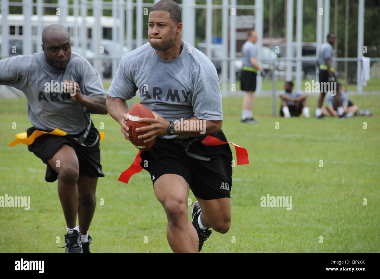 Staff Sgt. Jacob Hairston, with Headquarters and Headquarters Battery, 1st Battalion, 76th Field Artillery Regiment, 4th Infantry Brigade Combat Team, 3rd Infantry Division takes part in a flag football game, June 25, as part of Marne Week at Fort Stewart, Ga.  Staff Sgt. Tanya Polk Stock Photo