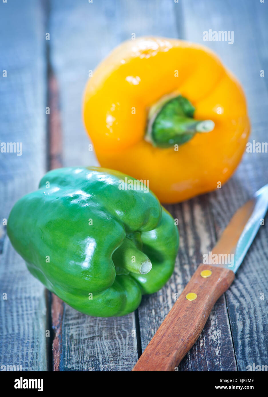 Table Peper color sweet pepper on the wooden table Stock Photo - Alamy
