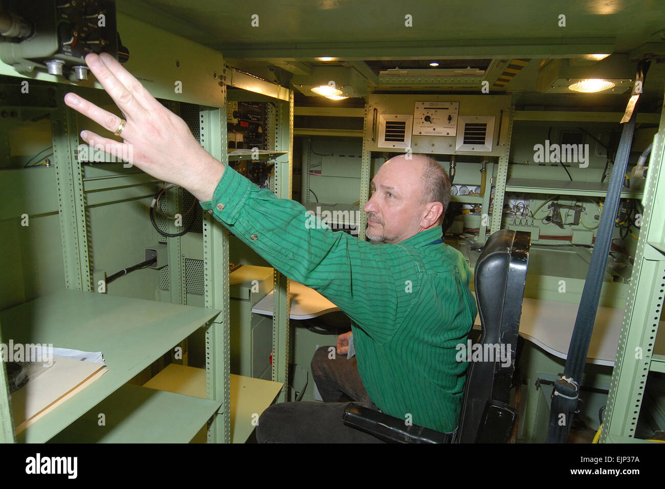 John Sedeski makes final adjustments to the vehicular intercom system ...