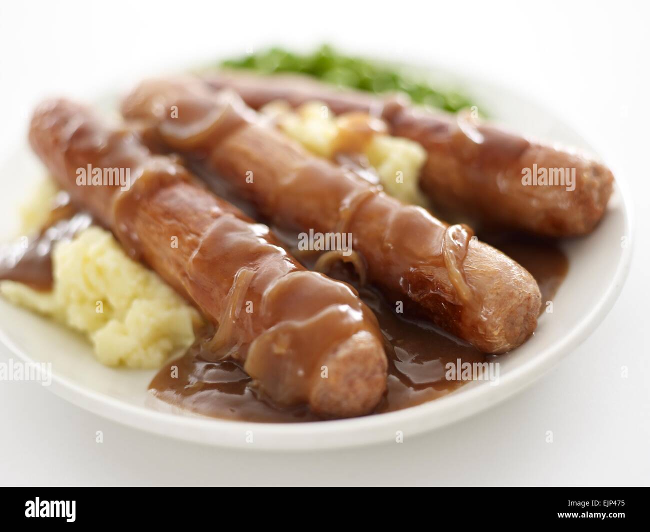 sausage onion gravy mashed potato and peas close Stock Photo Alamy