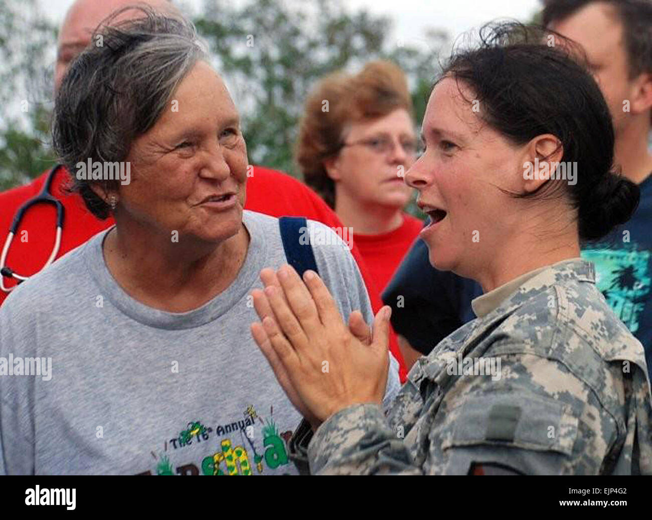 Sgt. Angela Fry, a member of the 528th Engineer Battalion headquartered in Monroe, La., rejoices with her aunt, Beverly Goodwich of Hackberry, La. Members of Fry's family were rescued on Sept. 13, 2008, by the joint efforts of the Louisiana Department of Wildlife and Fisheries, Calcasieu Sheriff's Department, 225th Engineer Brigade and 256th Infantry Brigade Combat Team after Hurricane Ike flooded the isolated southwestern Louisiana community.  Sgt. Rebekah L. Malone, 225th Engineer Brigade. Stock Photo