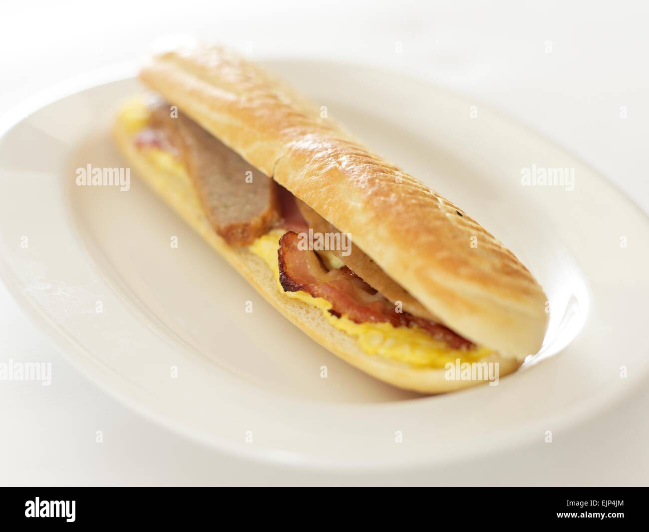 sausage egg and bacon breakfast baguette Stock Photo Alamy