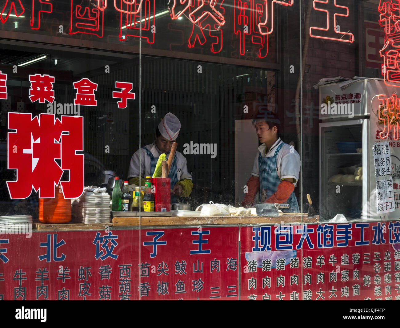 China, Beijing, traditional food next to newly built historically themed traditional street for tourists at Qianmen Stock Photo
