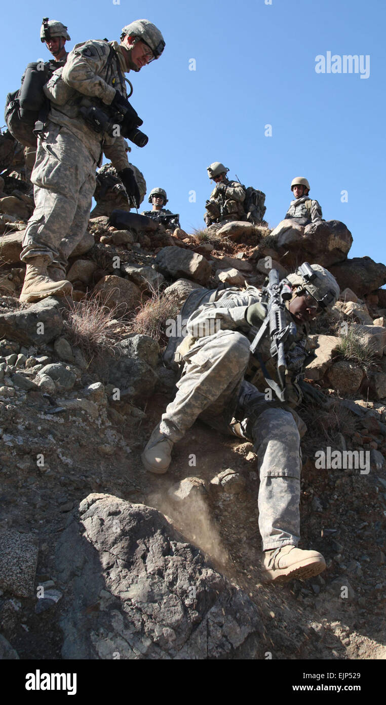 U.S. Army soldiers with Headquarters and Headquarters Company, 2nd Battalion, 327th Infantry Regiment negotiate the terrain as they head toward their destination during Operation Eagle Claw II in eastern Afghanistan's Kunar province on Dec. 10, 2010.  Eleven insurgents were killed during the two-day operation.   Spc. Andy Barrera, U.S. Army Stock Photo
