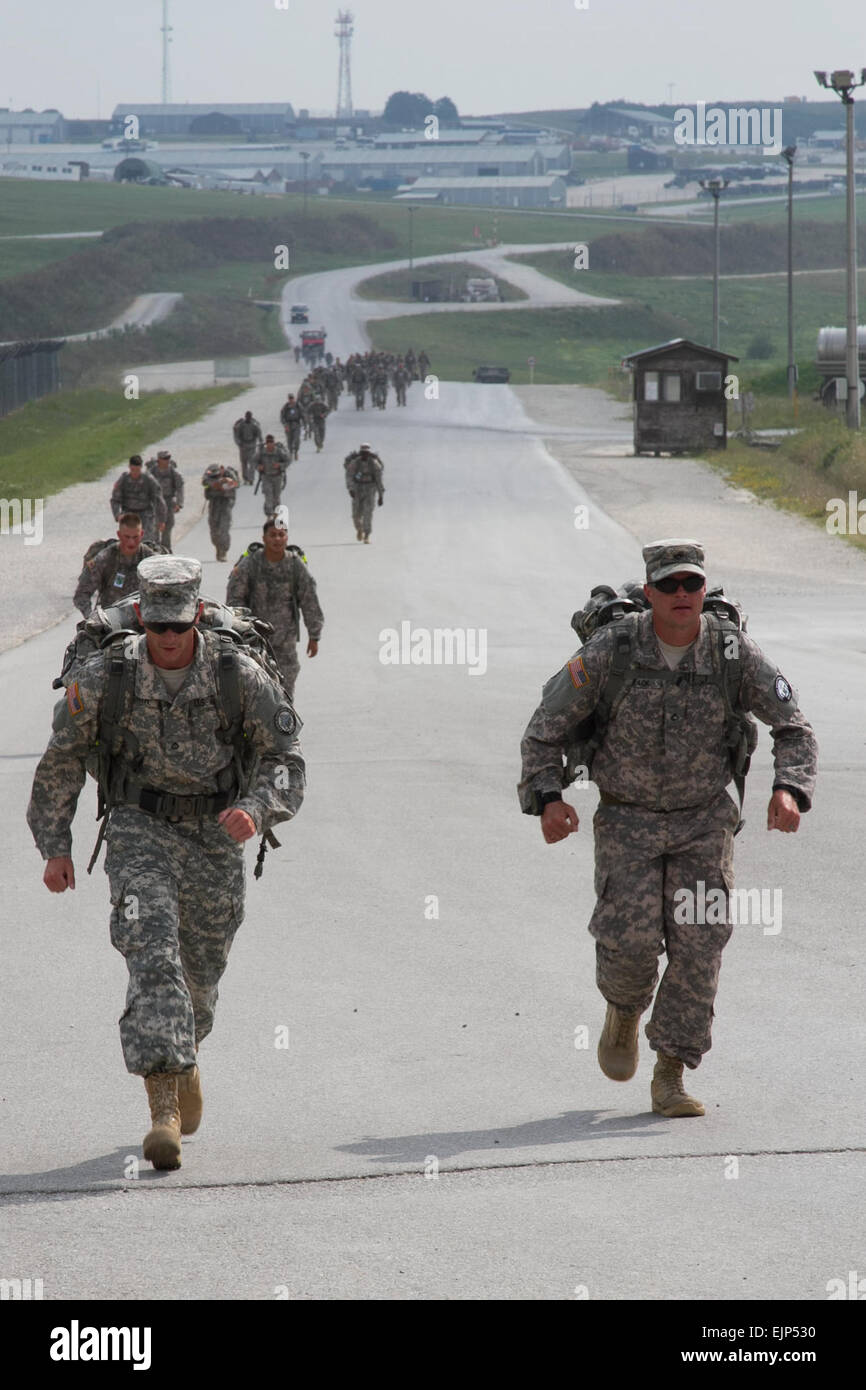 CAMP BONDSTEEL, Kosovo – Soldiers with Kosovo Force’s Multinational Battle Group-East compete in a  seven-mile ruck march as part of the German Armed Forces Proficiency Badge testing, Aug. 7. The badge, which is issued by the German army, tests participants in various physical fitness tasks and can be earned at the bronze, silver and gold levels. The badge can be earned and worn by U.S. service members.  Sgt. Cody Barber, 11th Public Affairs Detachment Stock Photo
