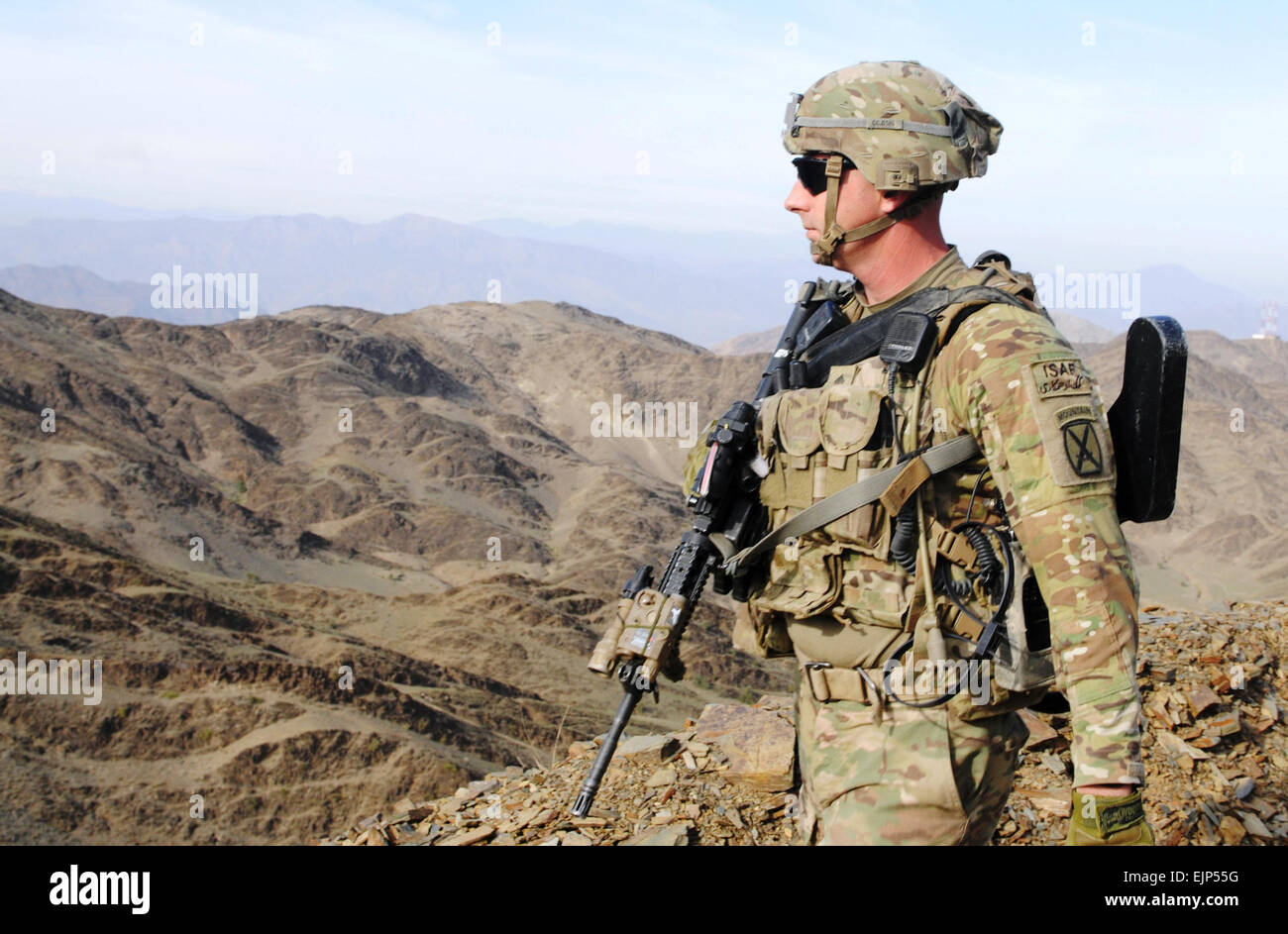 NANGAHAR PROVINCE, Afghanistan - U.S. Army Staff Sgt. Shelby Johnson scans the horizon Nov. 18, 2013, during a dismounted patrol from Forward Operating Base Torkham to an Afghan Border Police checkpoint near the village of Goloco. Johnson serves as a squad leader with Company C, 2nd Battalion, 30th Infantry Regiment, @4th Brigade 10th Mountain &quot;Patriots&quot;. The mission's purpose was to establish partnerships with the ABP officers at the checkpoint. This partnership will enhance security for Afghans and Coalition Forces operating in the area.  Sgt. Eric Provost, Task Force Patriot PAO Stock Photo