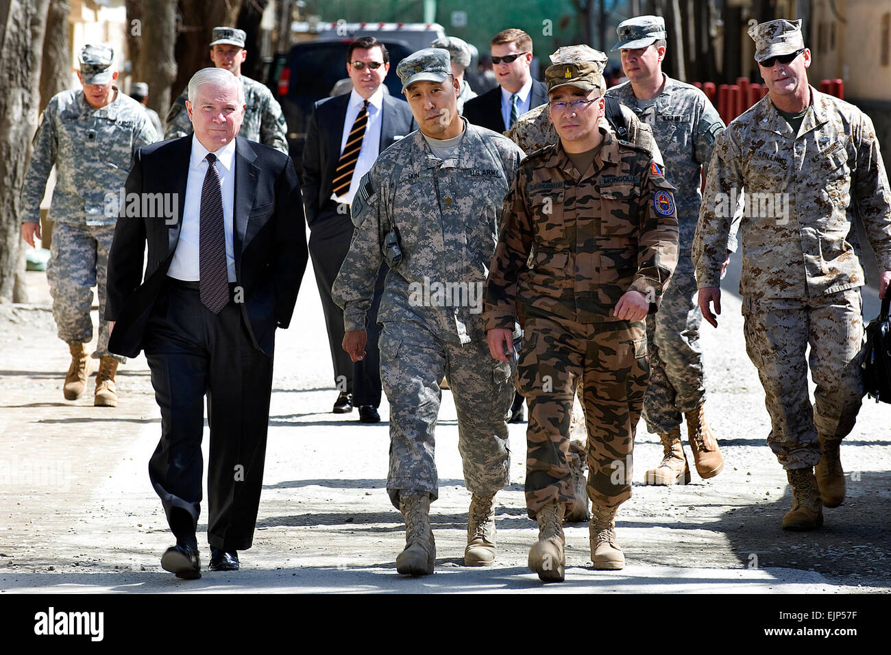 U.S. Defense Secretary Robert M. Gates, left, walks with Maj. Wayne Don, advisor for the Mongolian Expeditionary Task Force assigned to NATO Training Mission Afghanistan, and Mongolian Lt. Col.   Javkhlanbayar, senior representative of the contingent, on Camp Eggers in Kabul, March 8, 2010.        Gates seeks 'ground truth' in Afghanistan  /-news/2010/03/09/35549-gates-seeks-ground-truth-in-afghanistan/index.html Stock Photo