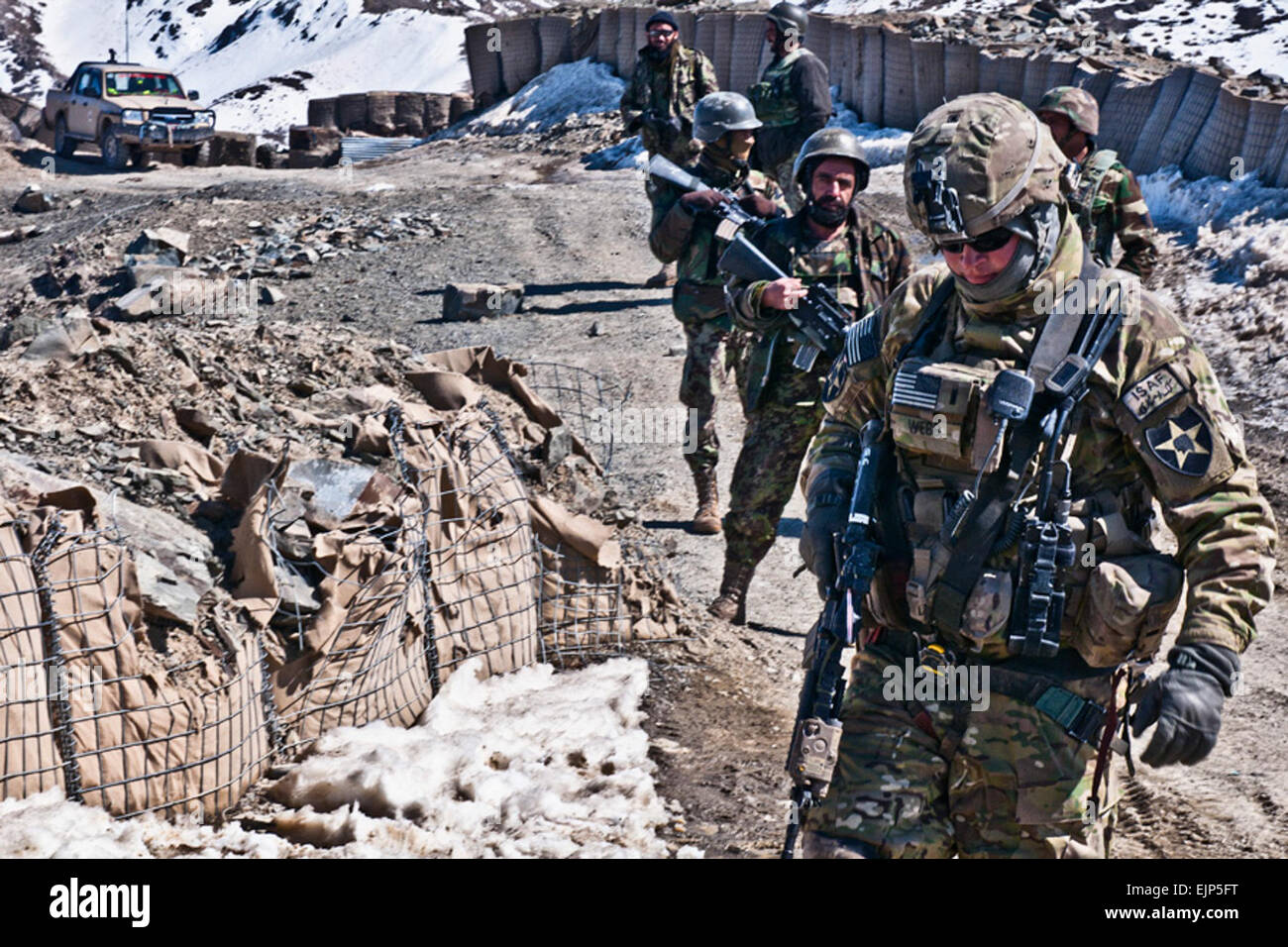 1st Lt. Daniel Webb of 3rd Stryker Brigade Combat Team, 2nd Infantry Division, checks the security at a checkpoint in Daab Pass in Shinkai district, Afghanistan Feb. 25. Stock Photo