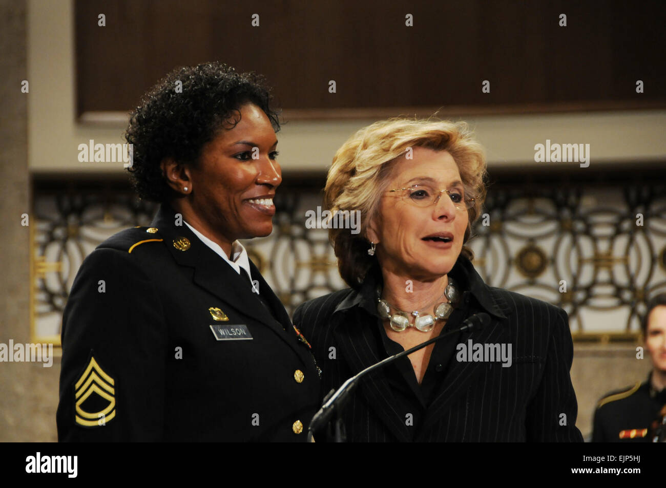 Sen. Barbara Boxer of California, right, presents a Senate Resolution to recognize the accomplishments of women in the military to Sgt. 1st Class Juanita Wilson, a wounded warrior, during the Joint Services Women's History Month Observance on Capitol Hill Thursday.&quot;          Senate resolution celebrates women in military  /-news/2010/03/05/35411-senate-resolution-celebrates-women-in-military/index.html Stock Photo