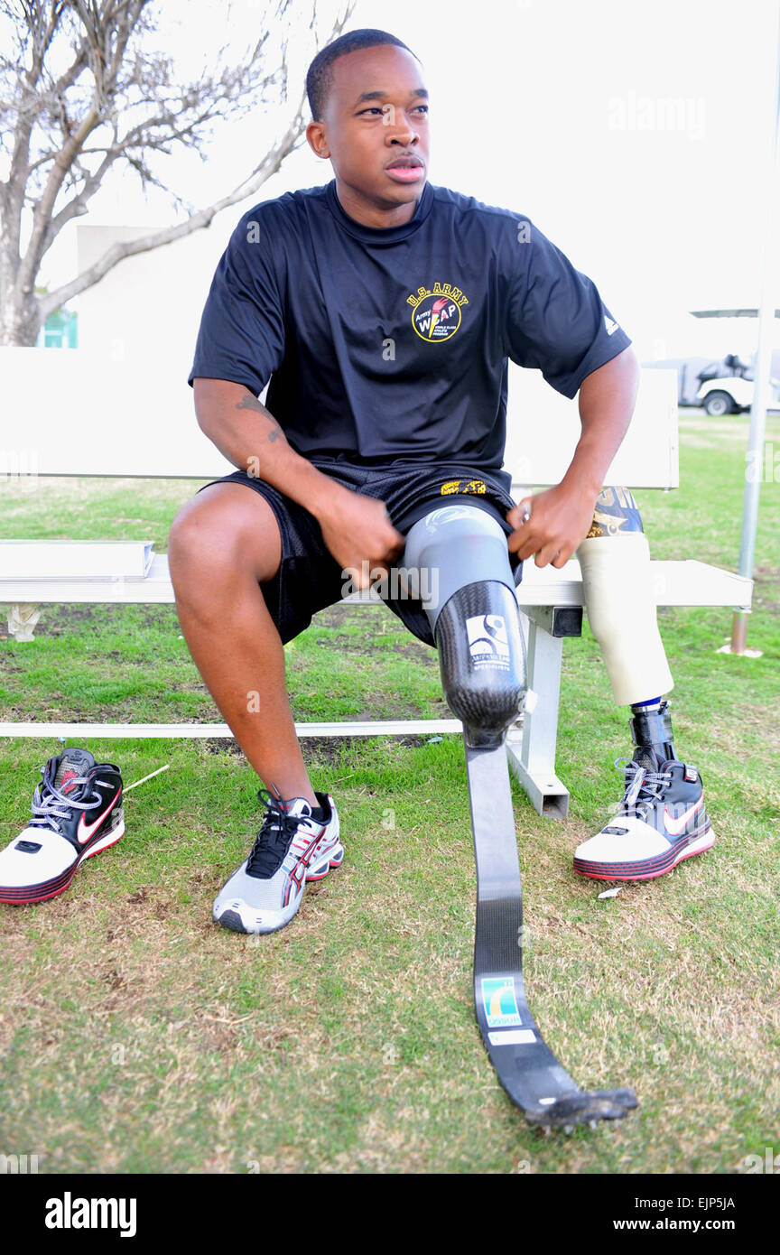 Sgt. Jerrod Fields, a U.S. Army World Class Athlete Program Paralympic sprinter hopeful, changes his prosthesis before running a track workout at the U.S. Olympic Training Center in Chula Vista, Calif.   Tim Hipps, FMWRC Public Affairs         Below-knee amputee runs for berth in 2012 Paralympics  /-news/2009/07/22/24737-below-knee-amputee-runs-for-berth-in-2012-paralympics/ Stock Photo