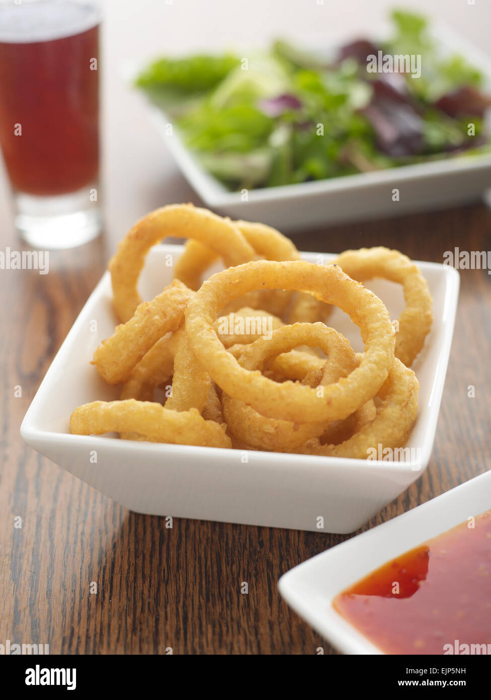 Fried beer batter onion rings hi-res stock photography and images - Alamy