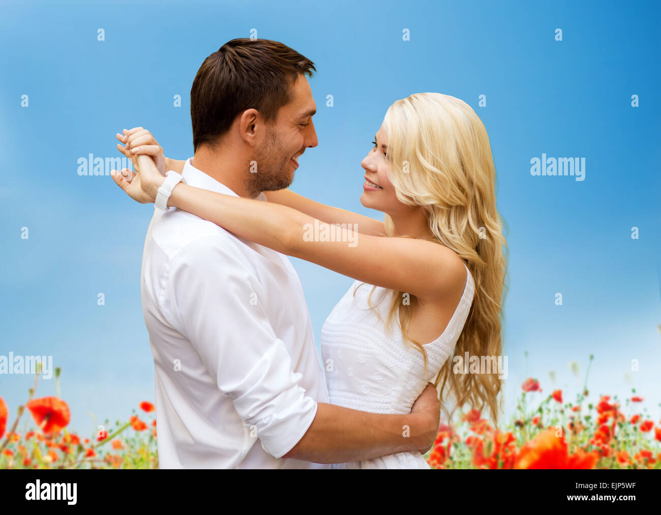 happy couple hugging over natural background Stock Photo - Alamy