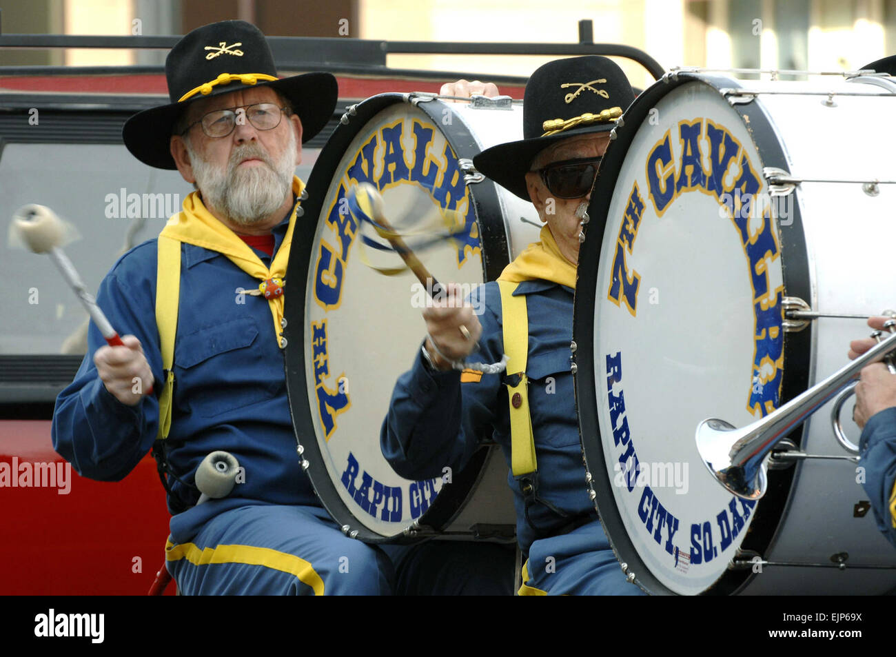 Members of the 7th Cavalry Drum and Bugle Corps perform in a parade in