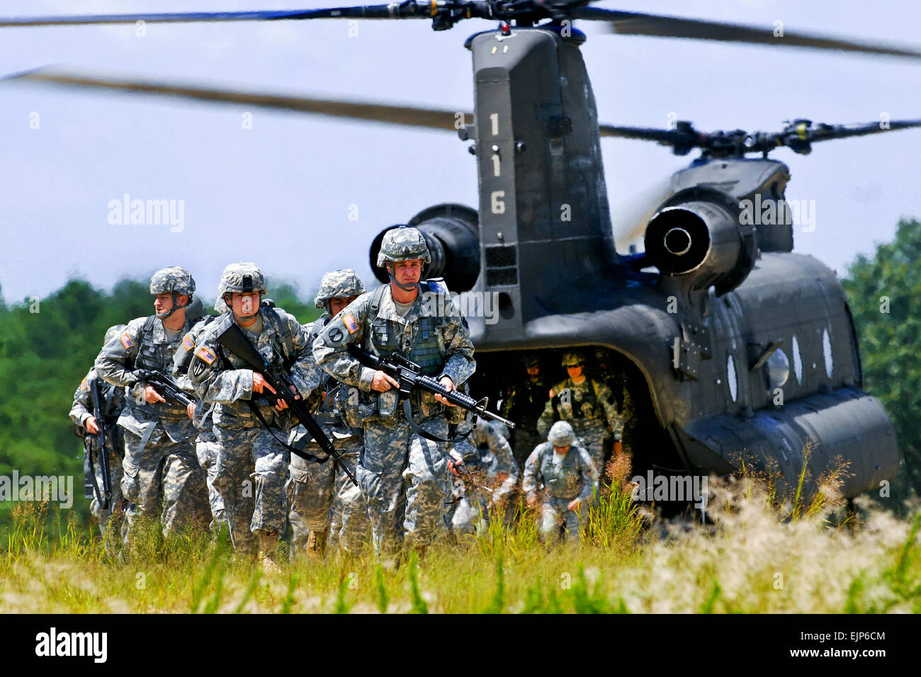 A CH-47 Chinook helicopter drops off Army soldiers to practice squad-level tactics during Operation Checkerboard on Joint Base McGuire-Dix-Lakehurst, N.J., Aug. 10, 2011. The soldiers are assigned to Headquarters Company, 99th Regional Support Command. The tactics include moving as a squad, reacting to contact, establishing a perimeter and conducting a tactical road march  Staff Sgt. Shawn Morris Stock Photo