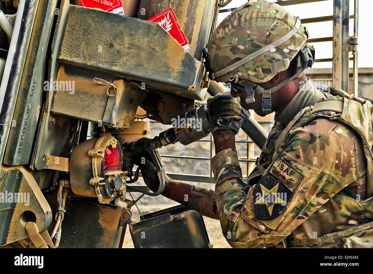 Pfc. Rashaad Lawrence, a mechanic with 1st Battalion, 17th Infantry Regiment, 2nd Infantry Division, refuels a Stryker vehicle in the field during Operation Buffalo Thunder II in the Shorabak district, Afghanistan, June 30, 2012. Lawrence hails from Fridley, Minn. Stock Photo