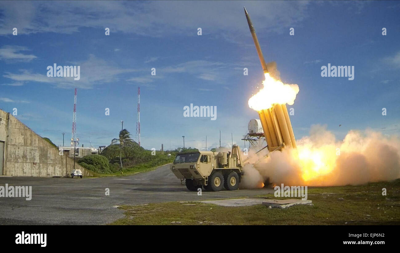 The first of two Terminal High Altitude Area Defense THAAD interceptors is launched during a successful intercept test. The test, conducted by Missile Defense Agency MDA, Ballistic Missile Defense System BMDS Operational Test Agency, Joint Functional Component Command for Integrated Missile Defense, and U.S. Pacific Command, in conjunction with U.S. Army Soldiers from the Alpha Battery, 2nd Air Defense Artillery Regiment, U.S. Navy sailors aboard the guided missile destroyer USS Decatur DDG-73, and U.S. Air Force airmen from the 613th Air and Operations Center resulted in the intercept of one  Stock Photo