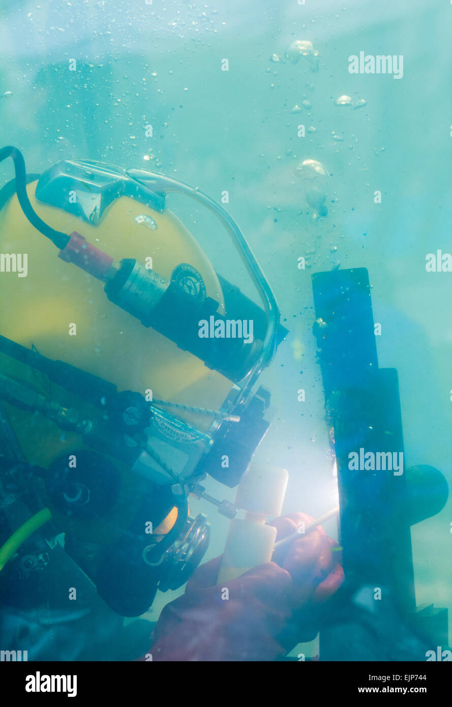 Diver welding underwater Stock Photo