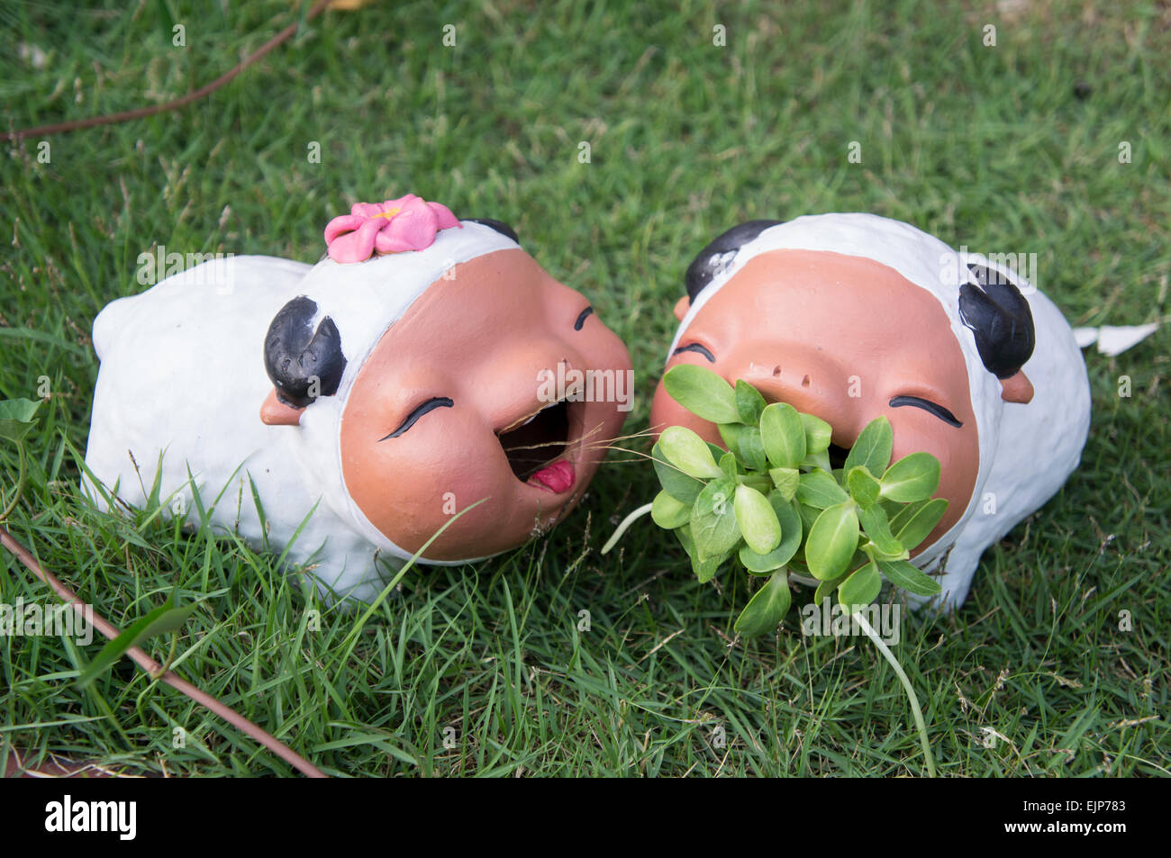 sheep ceramic doll garden grass two young Stock Photo