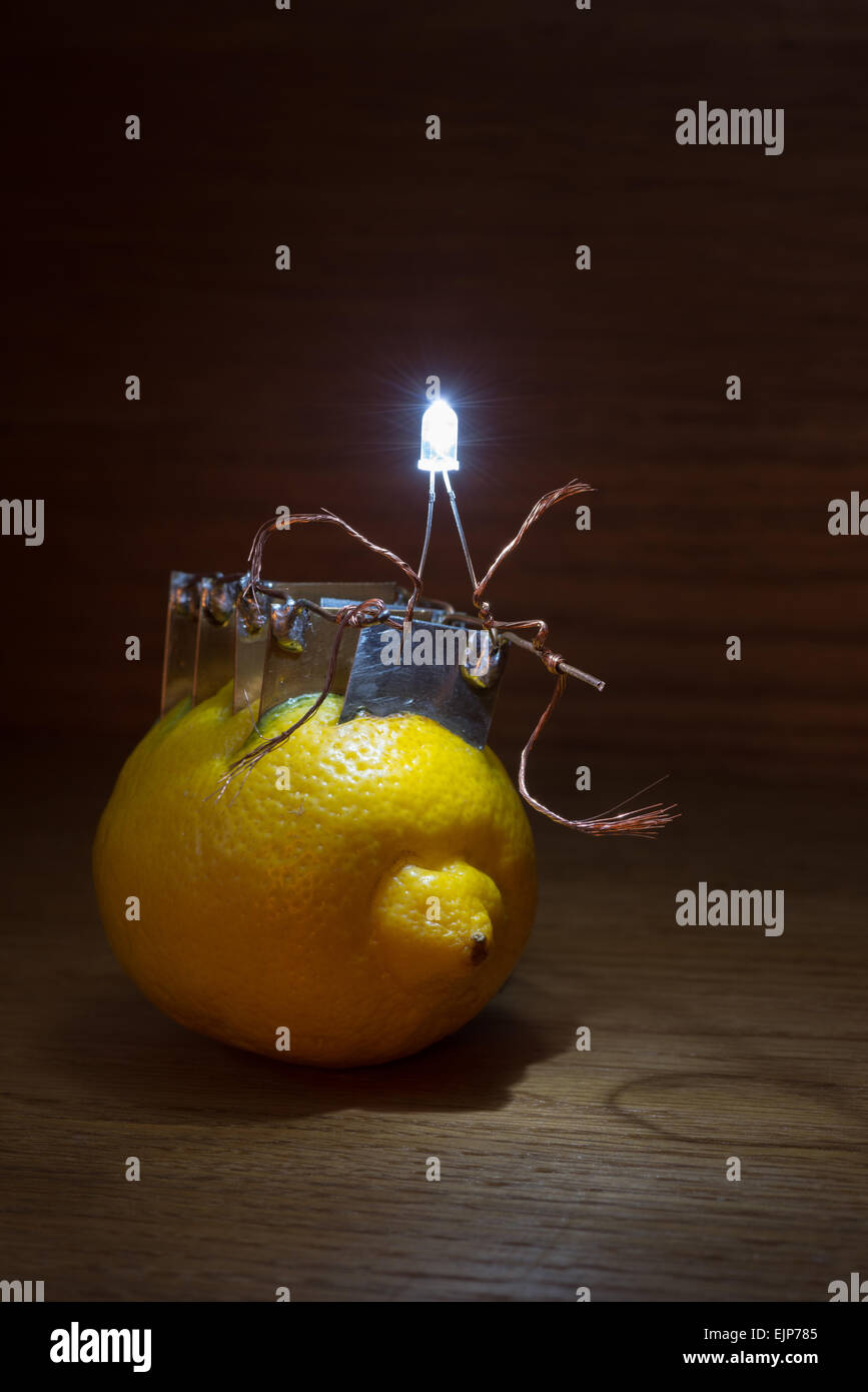 alternative energy source electrical current of lemon provides voltage and electric energy to