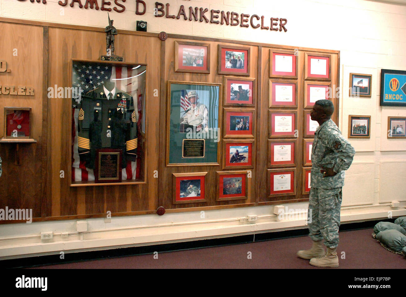 Fort Bliss Garrison Command Sgt. Maj. Tony H. Purdy pauses in front of a memorial wall dedicated to Command Sgt. Maj. James D. Blankenbecler, who died in Samarra, Iraq Oct. 1, 2003, during a convoy mission while serving in Operation Iraqi Freedom. The Noncommissioned Officer Academy classroom, where Soldiers train to become future leaders, was dedicated and named in Blankenbecler's honor a year after his death.  Wilson Rivera, Fort Bliss Monitor  Wilson Rivera Fort Bliss Monitor Stock Photo