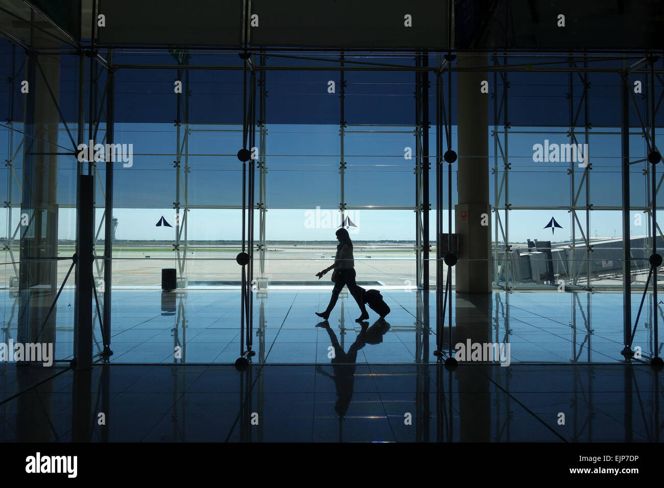 Passenger walking to departure gate inside Terminal 2, El Prat Airport