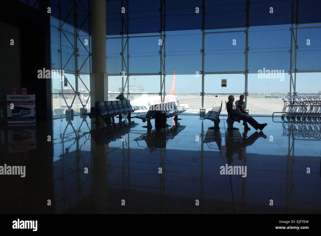 Passengers waiting inside Terminal 2 C (M0) departure area, El Prat Airport, Barcelona Stock