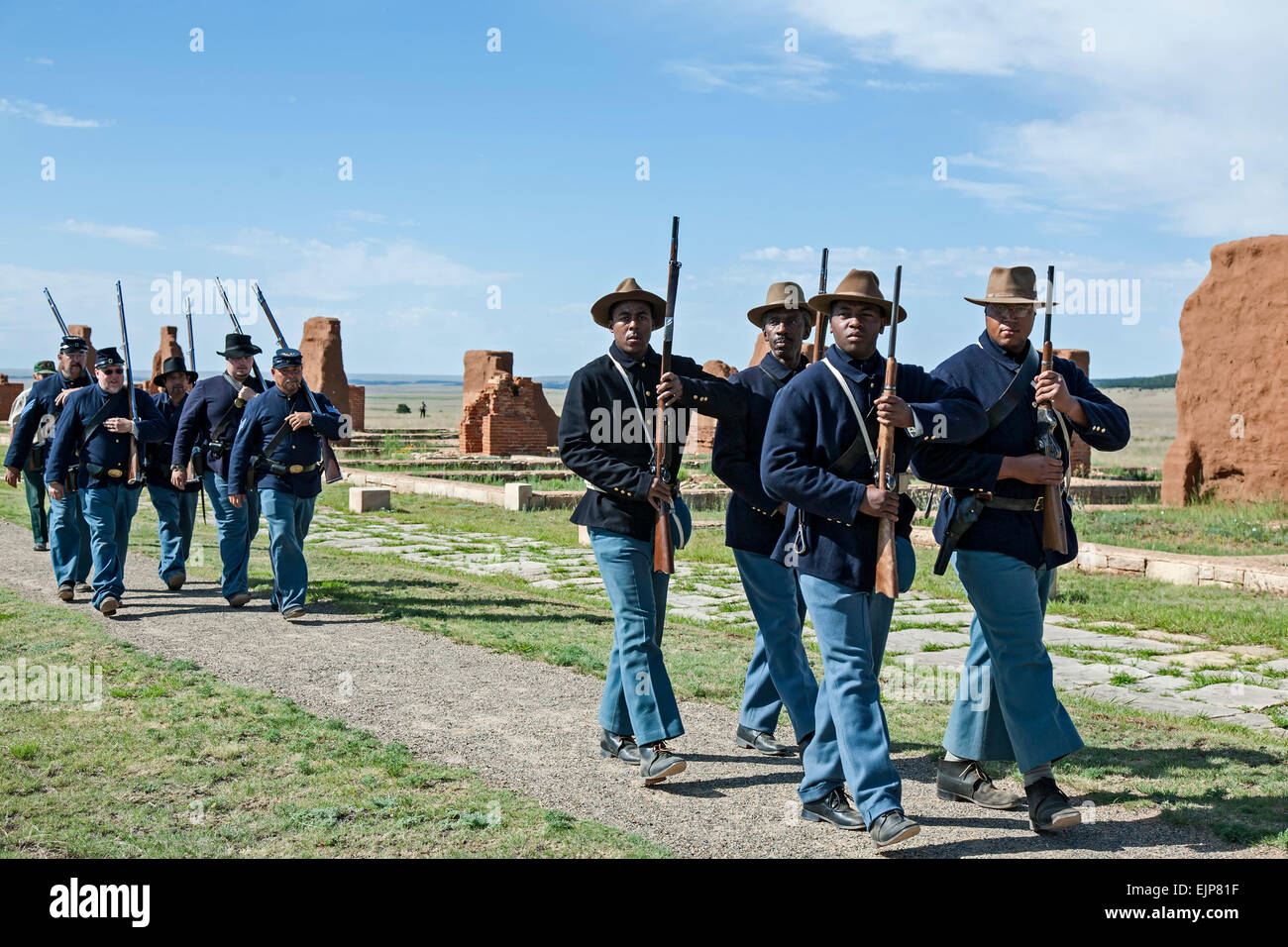 Civil War Era Buffalo Soldiers reenactors marching in formation, Fort Union National Monument, New Mexico USA Stock Photo