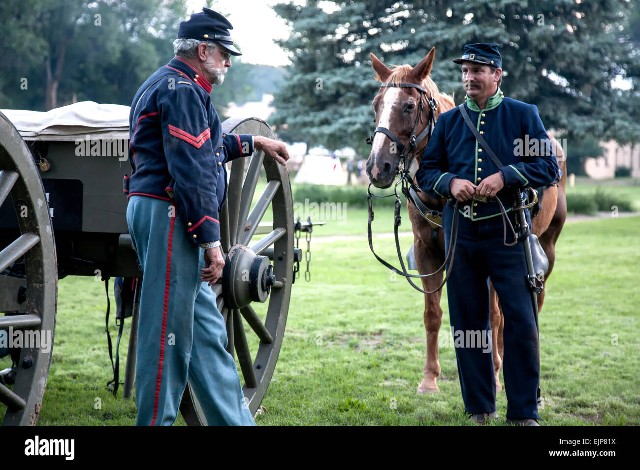 Civil War Era Union soldier reenactors, cannon, and horse, having a conversation, Fort Stanton Live!, Fort Stanton, New Mexico Stock Photo