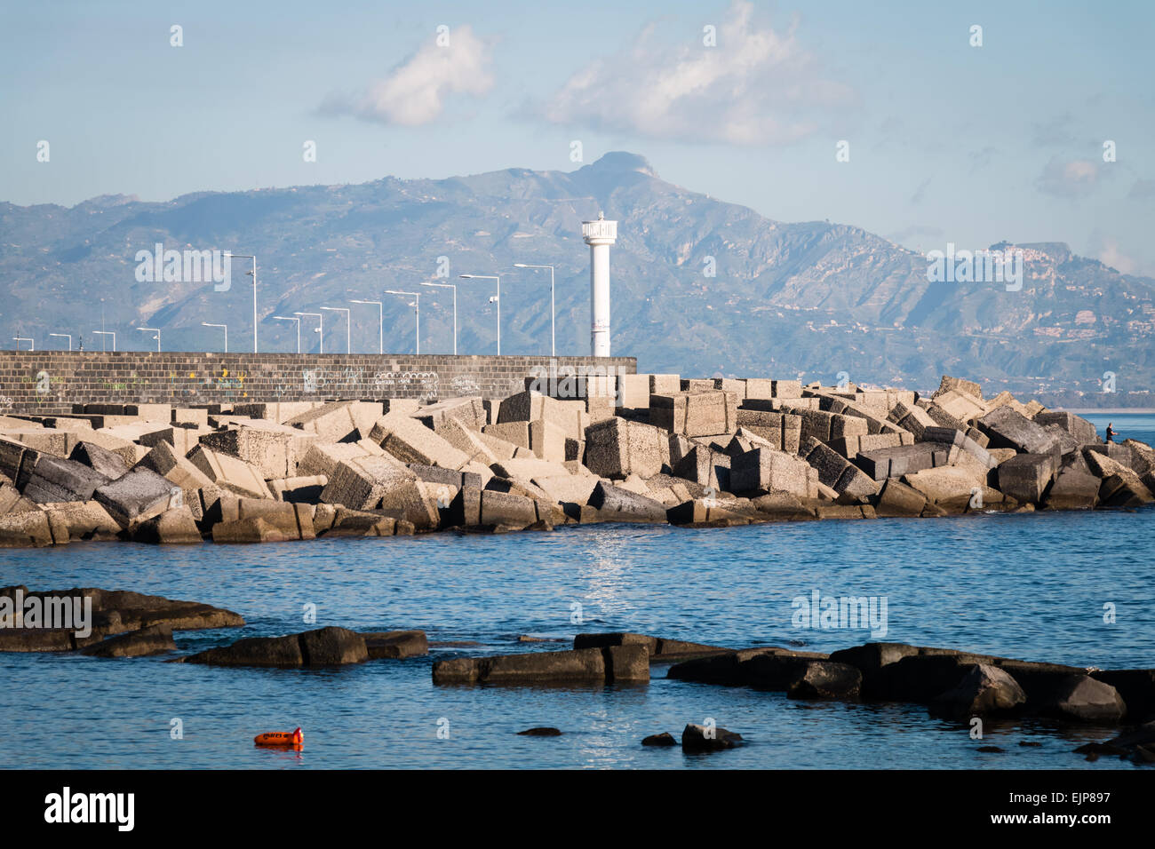 Port of Riposto with lighthouse and rocks protection Stock Photo