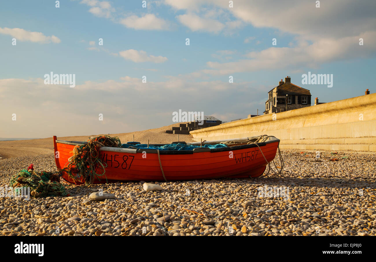 Lone fishing boat moored on Chesil Beach Stock Photo Alamy