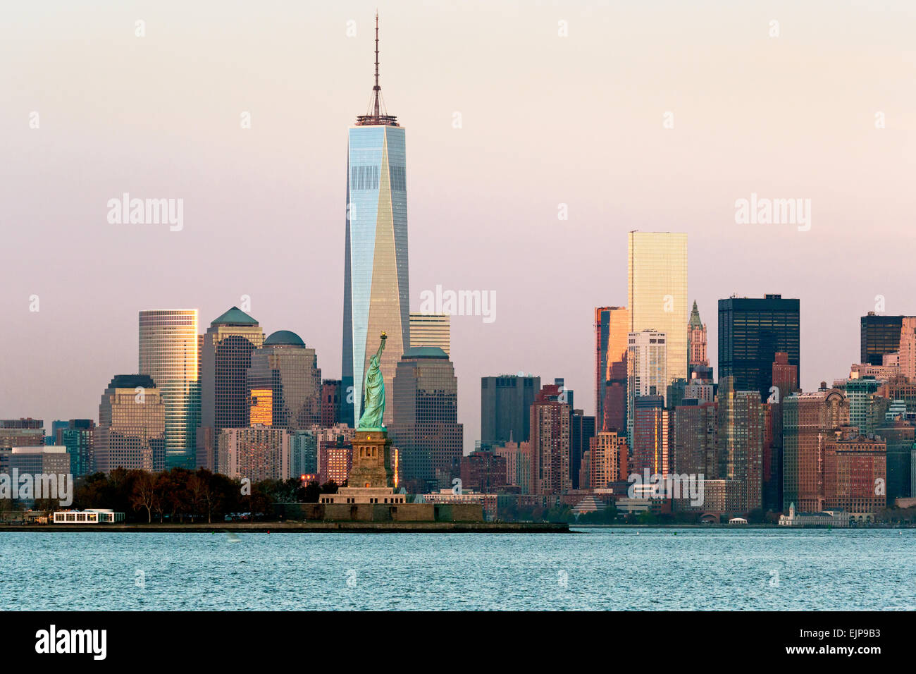 Statue of Liberty, One World Trade Center and Downtown Manhattan across the Hudson River, New York, United States of America Stock Photo