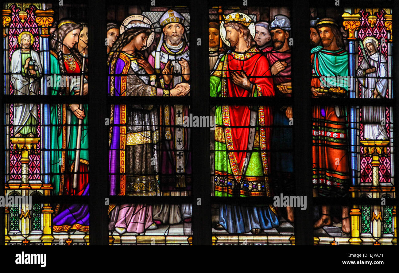 Stained Glass Window depicting the Sacrament of Holy Matrimony, with Pepin of Landen and Itesberga united in marriage. Stock Photo