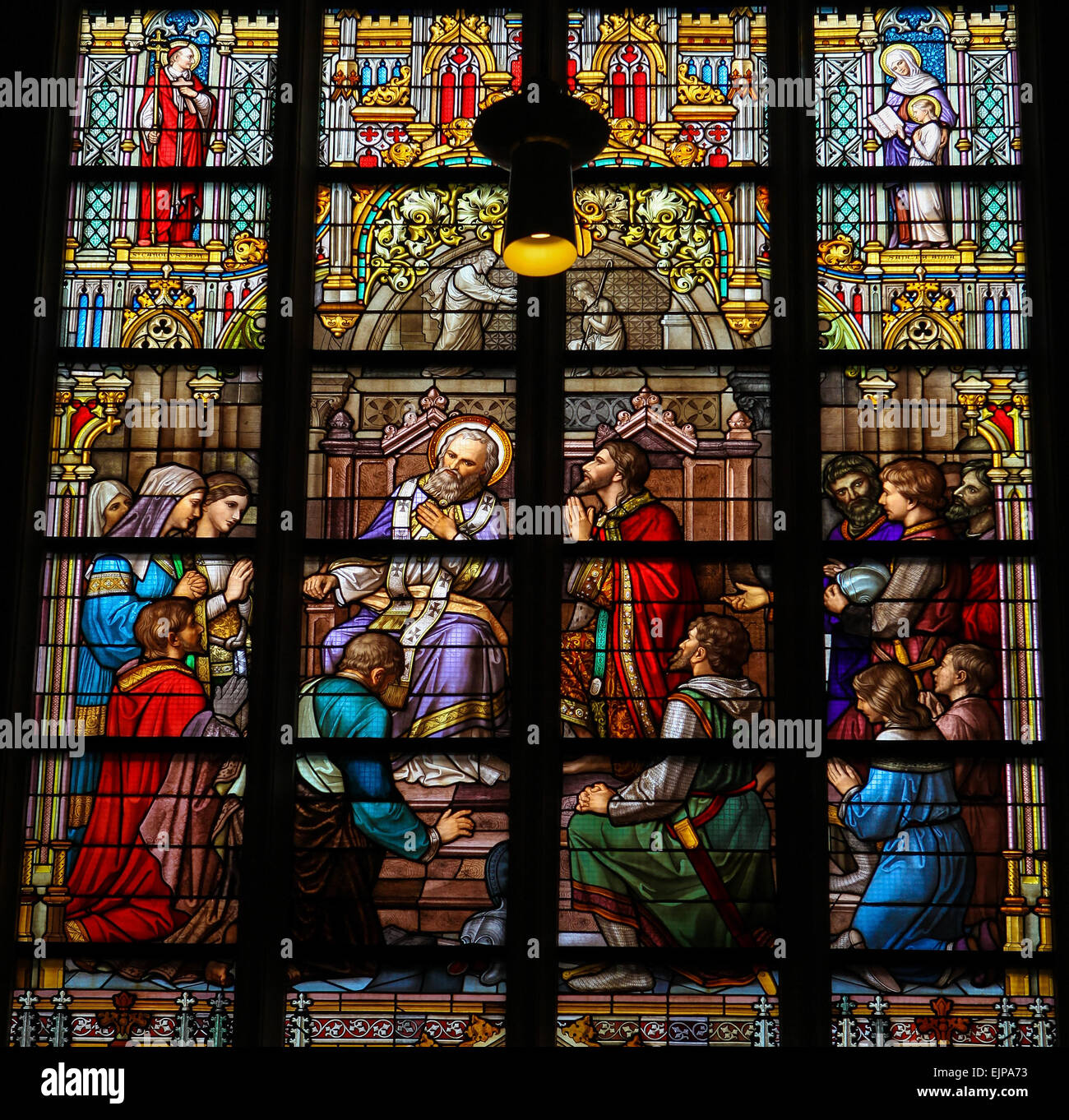 Stained Glass Window depicting the Sacrament of Confession or Penance, with Pepin of Herstal confessing his sins to Saint Wiro Stock Photo