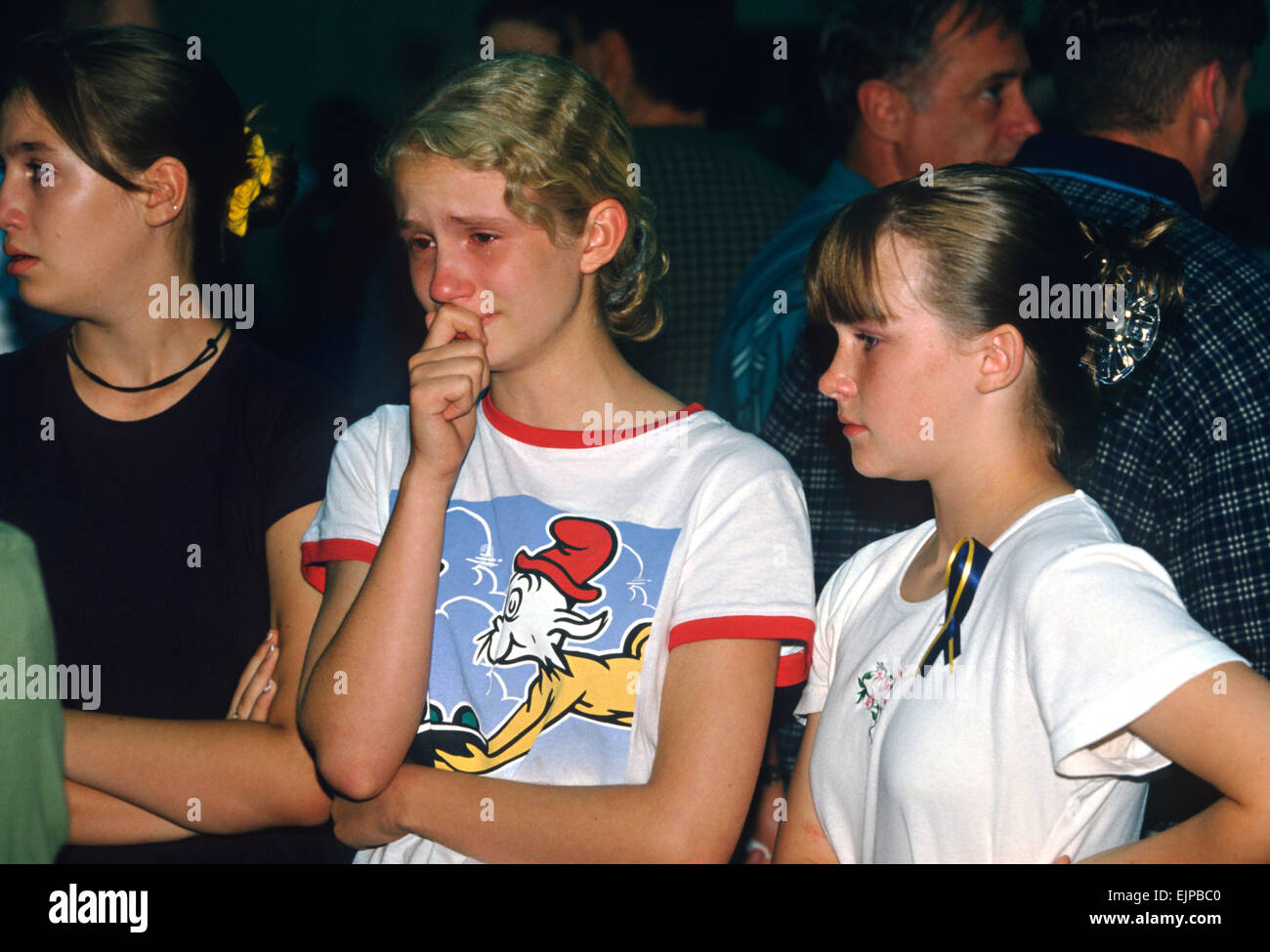 Students mourn their friends killed aboard TWA Airlines Flight 800 at a memorial service July 18, 1996 in Montoursville, PA. TWA Flight 800 exploded off East Moriches, NY with the loss of 230 lives including 21 students from the town. Stock Photo