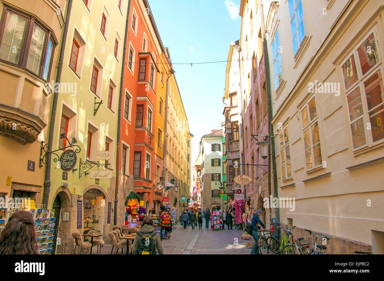 A tight European street in the town of Innsbruck, Austria that rests at the base of the Austrian Alps. Stock Photo