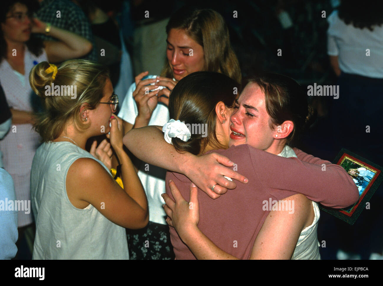 Students mourn their friends killed aboard TWA Airlines Flight 800 July 18, 1996 in Montoursville, PA. TWA Flight 800 exploded off East Moriches, NY with the loss of 230 lives including 21 students from the town. Stock Photo
