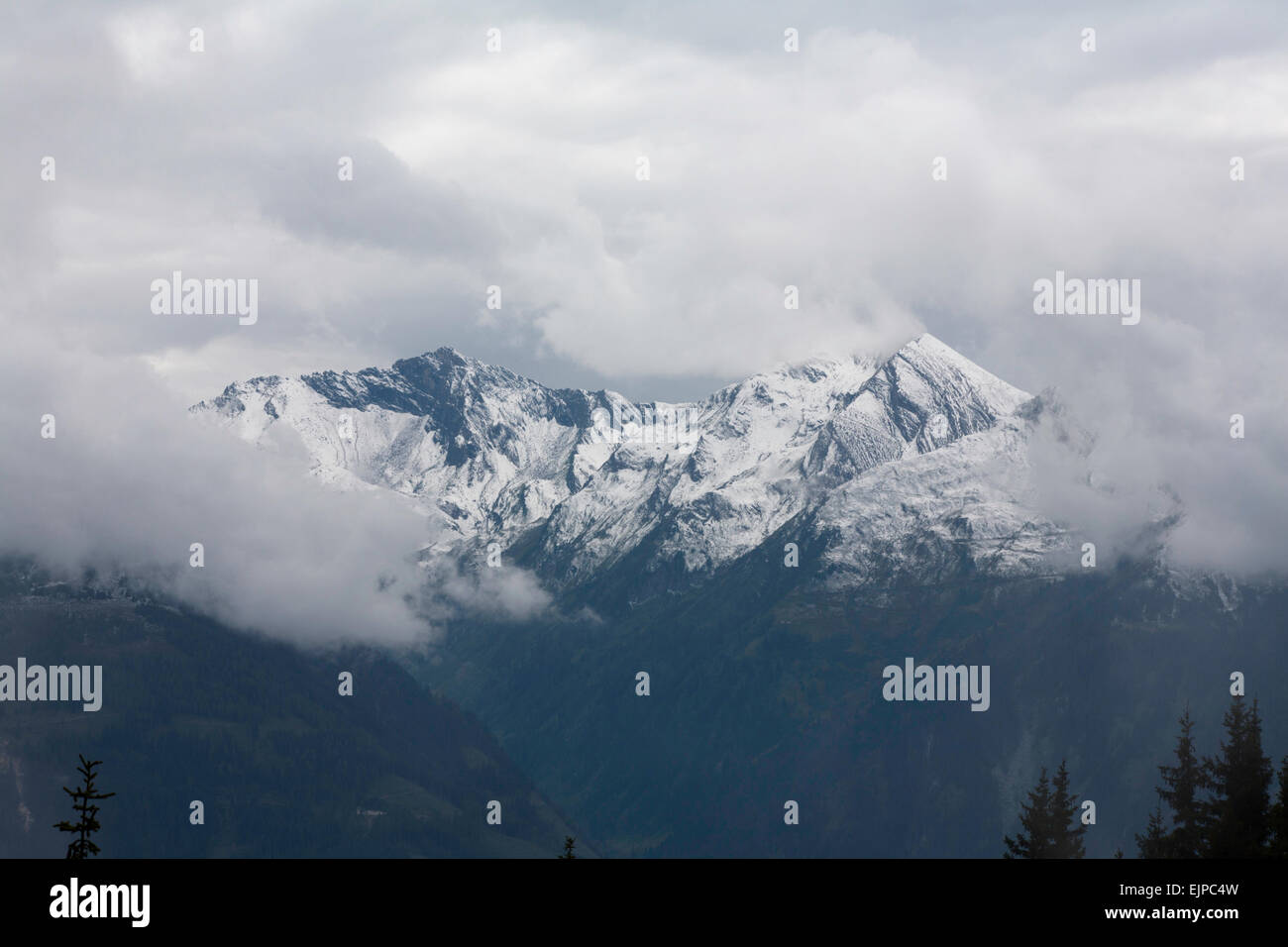 Cloud and mist swirling around mount summits above Kaprun Hohe Tauern National Park  Pinzgau Salzburgerland Austria Stock Photo