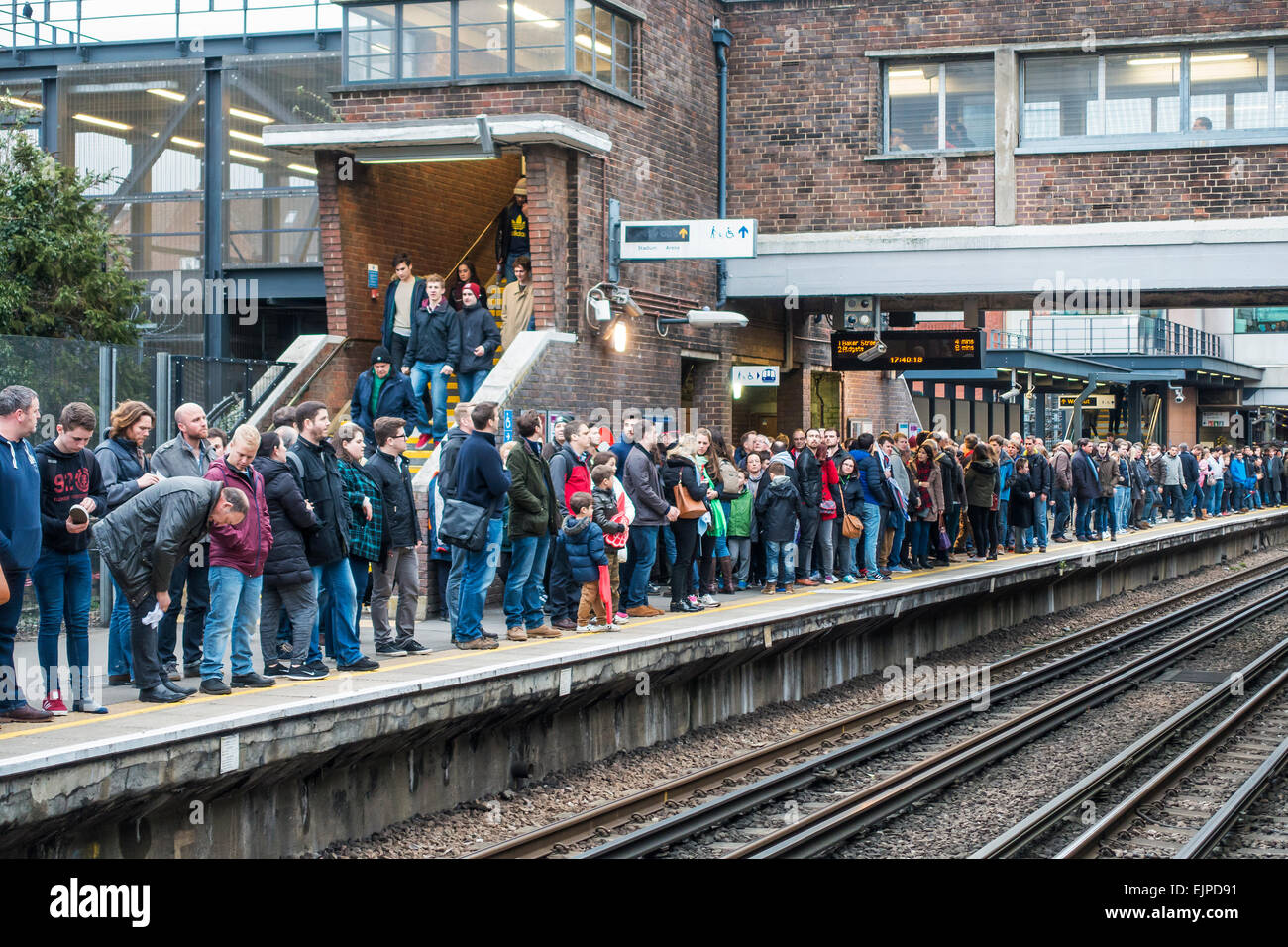 Large Crowd waiting for tube train. Wembley Park Station Platform Stock Photo