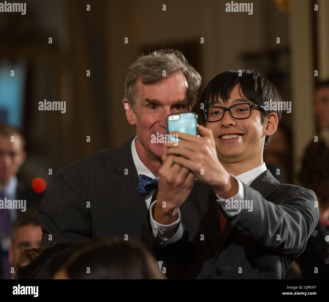 Washington DC:  Bill Nye The Science Guy takes a selfie with a student in the East Room of the White House. Stock Photo