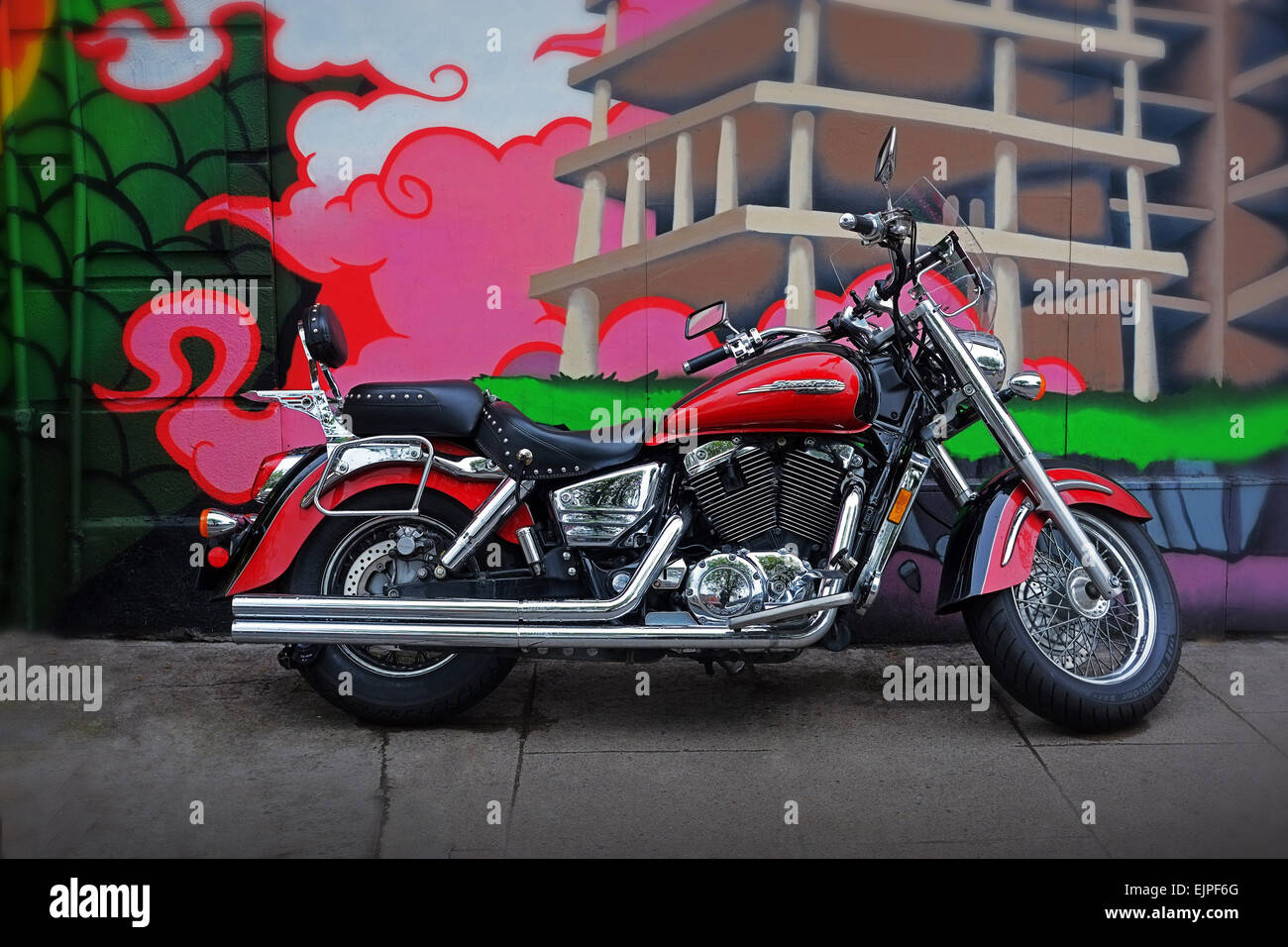 Honda Shadow Aero 11000 cruiser motorcycle parked in front of a graffiti covered wall in Dublin Ireland. Stock Photo