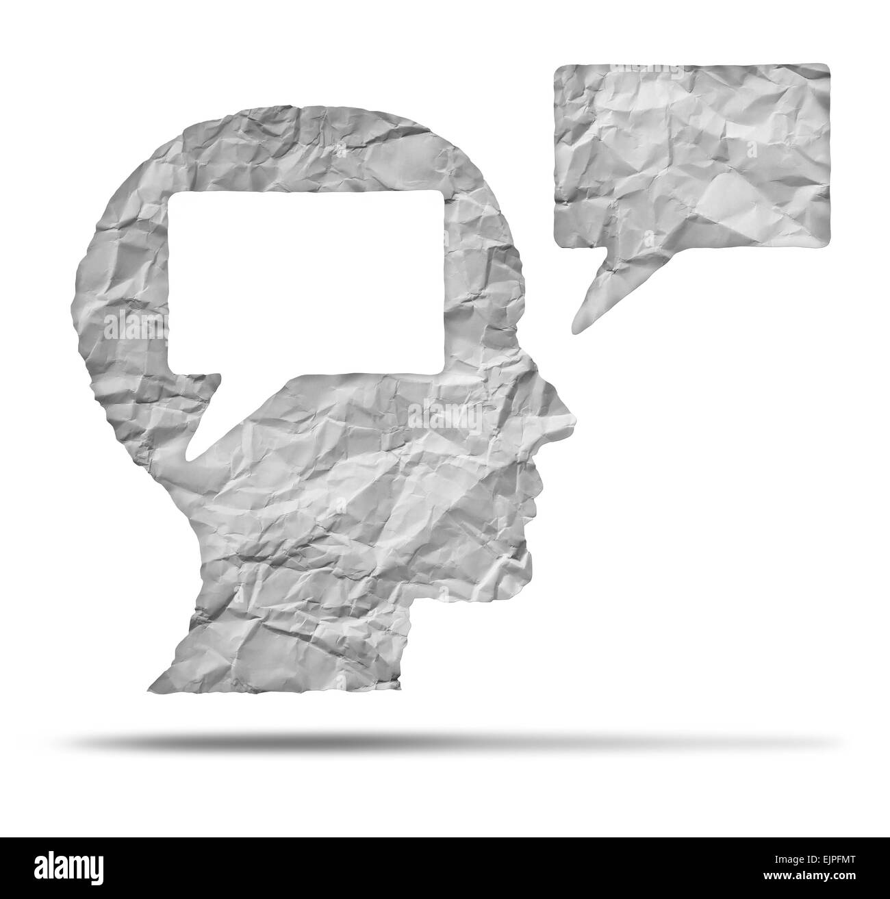 Speak out concept and express your opinion symbol as a crumpled paper shaped as a human head and talk balloon as a communication icon for broadcasting inner thoughts. Stock Photo
