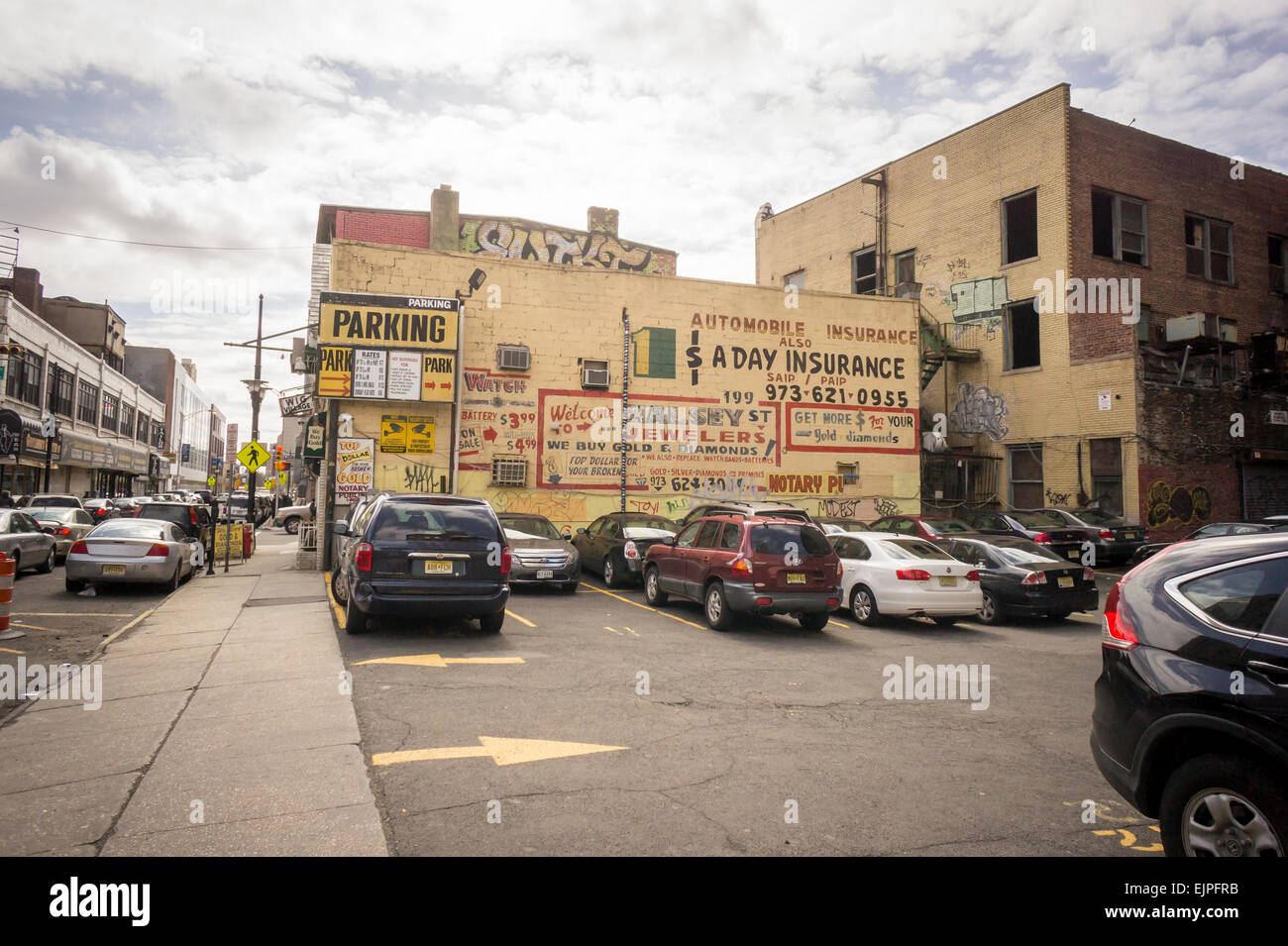 Parking lot with advertising on the wall of a building in downtown