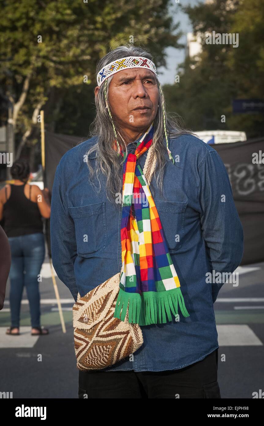 Buenos Aires, Argentina. 30th Mar, 2015. Indigenous peoples of the Qom ethnic group block the intersection of Av. de Mayo and Av. 9 de Julio during rush hour to raise attention on