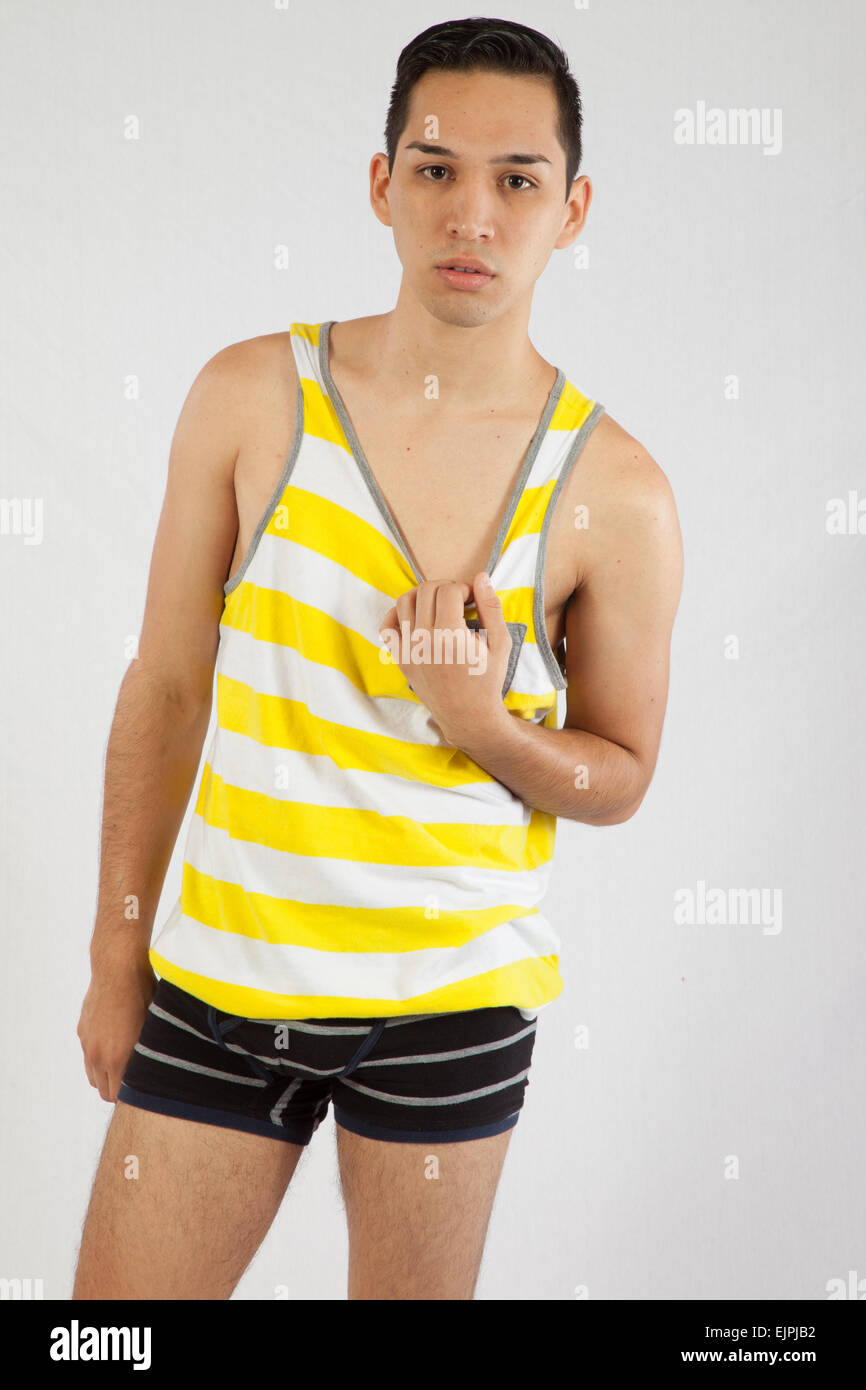 Young man looking serious in tank top and shorts Stock Photo